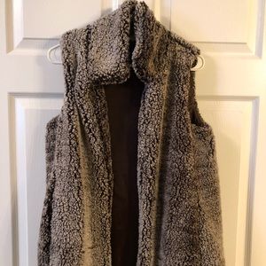 brown fur vest. never worn!!